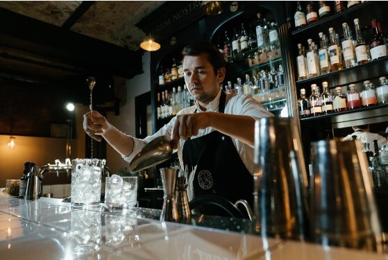 Bartender stirring a pitcher